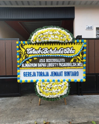 Papan Bunga Duka di Kamanisan